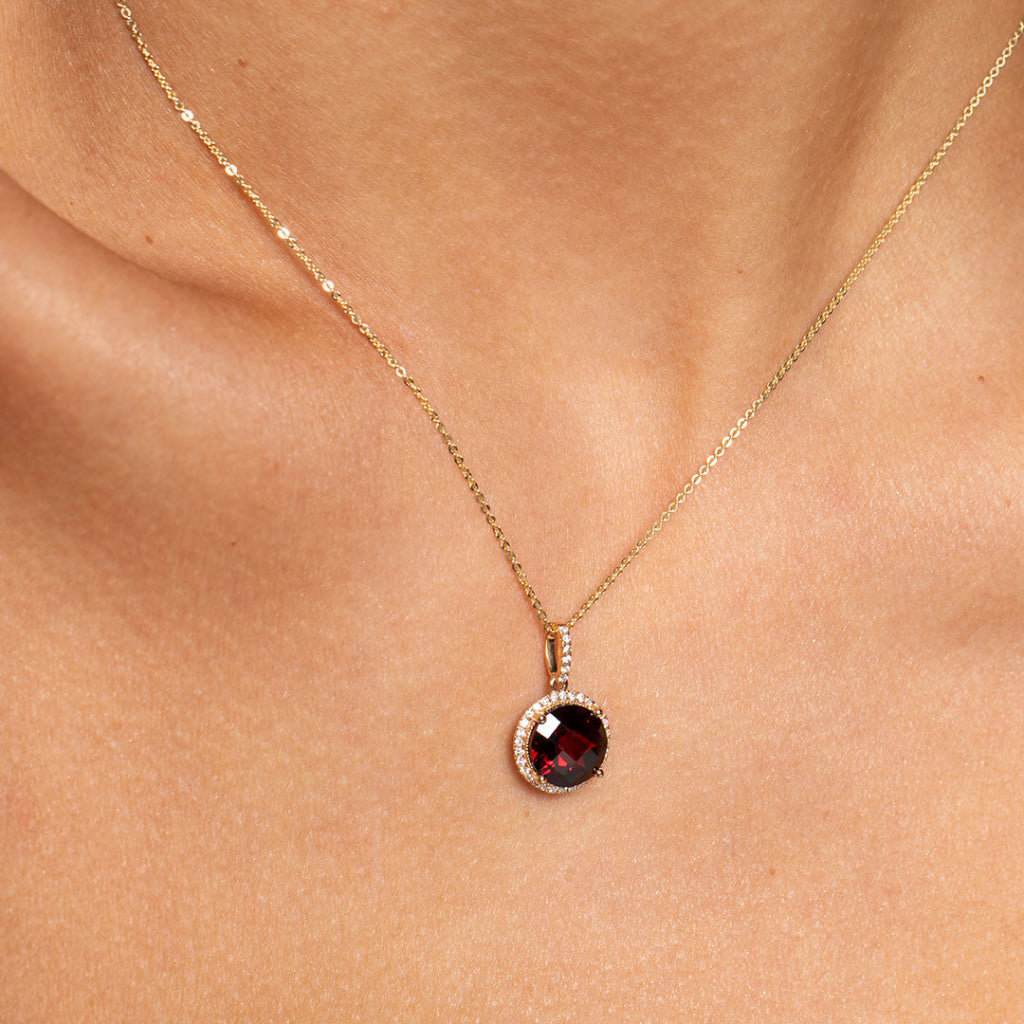 Up-close image of necklace on models necklace