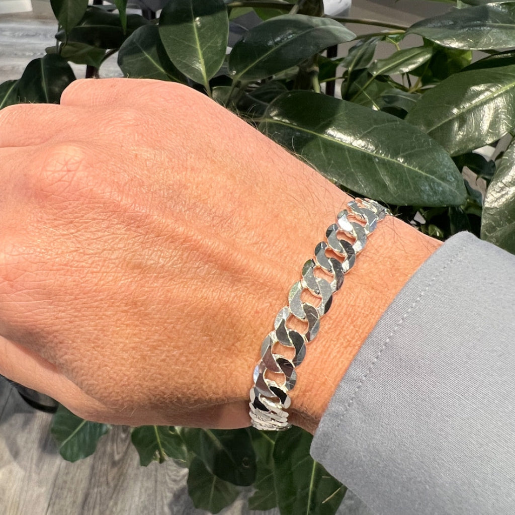 gents silver curb bracelet shown on a wrist