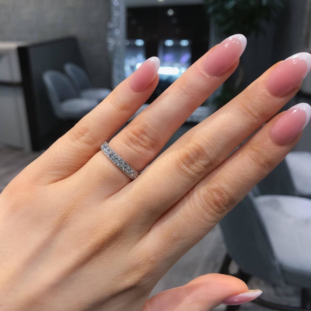 Godiva - Diamond wedding ring on woman's hand
