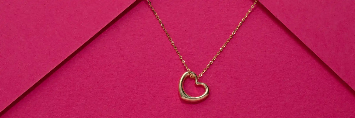 Gold heart pendant necklace.