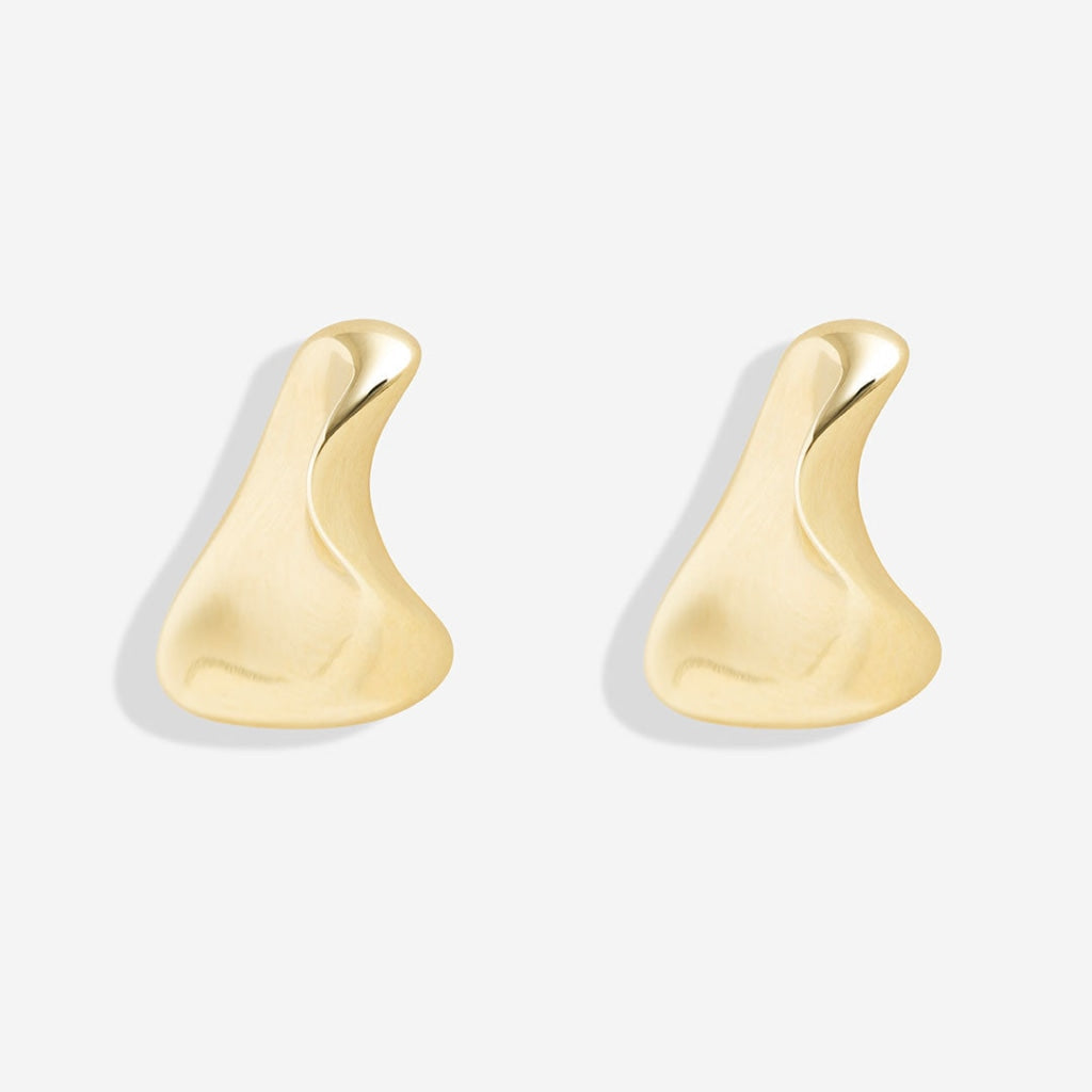 golden nugget earrings on white background