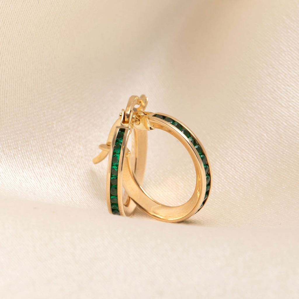 green stone channel set yellow gold hoops