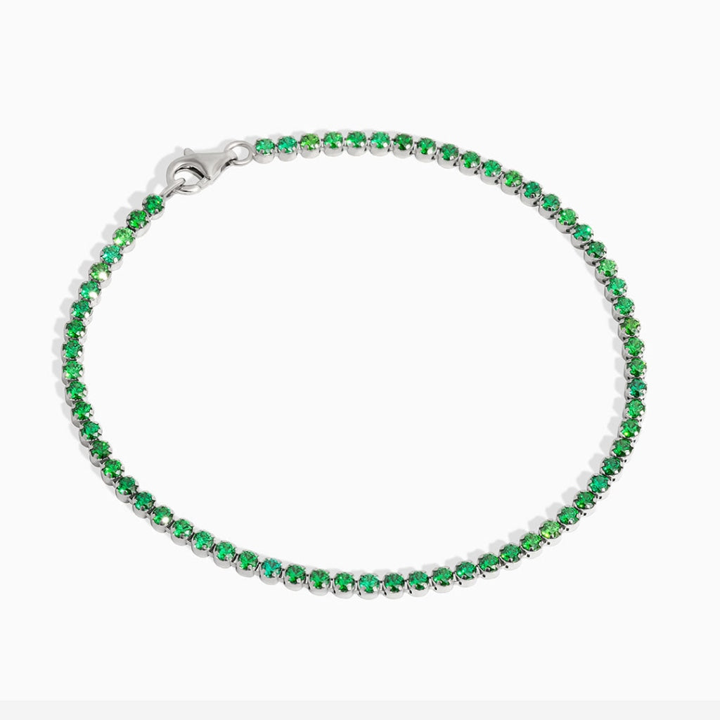 Green Cz tennis bracelet on white background