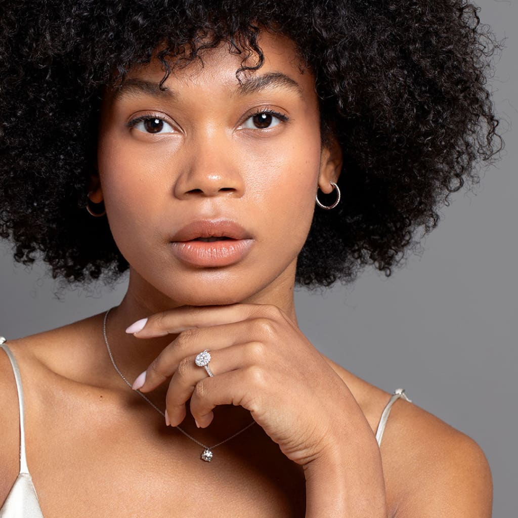 White gold look showcasing engagement ring, hoop earrings and necklace