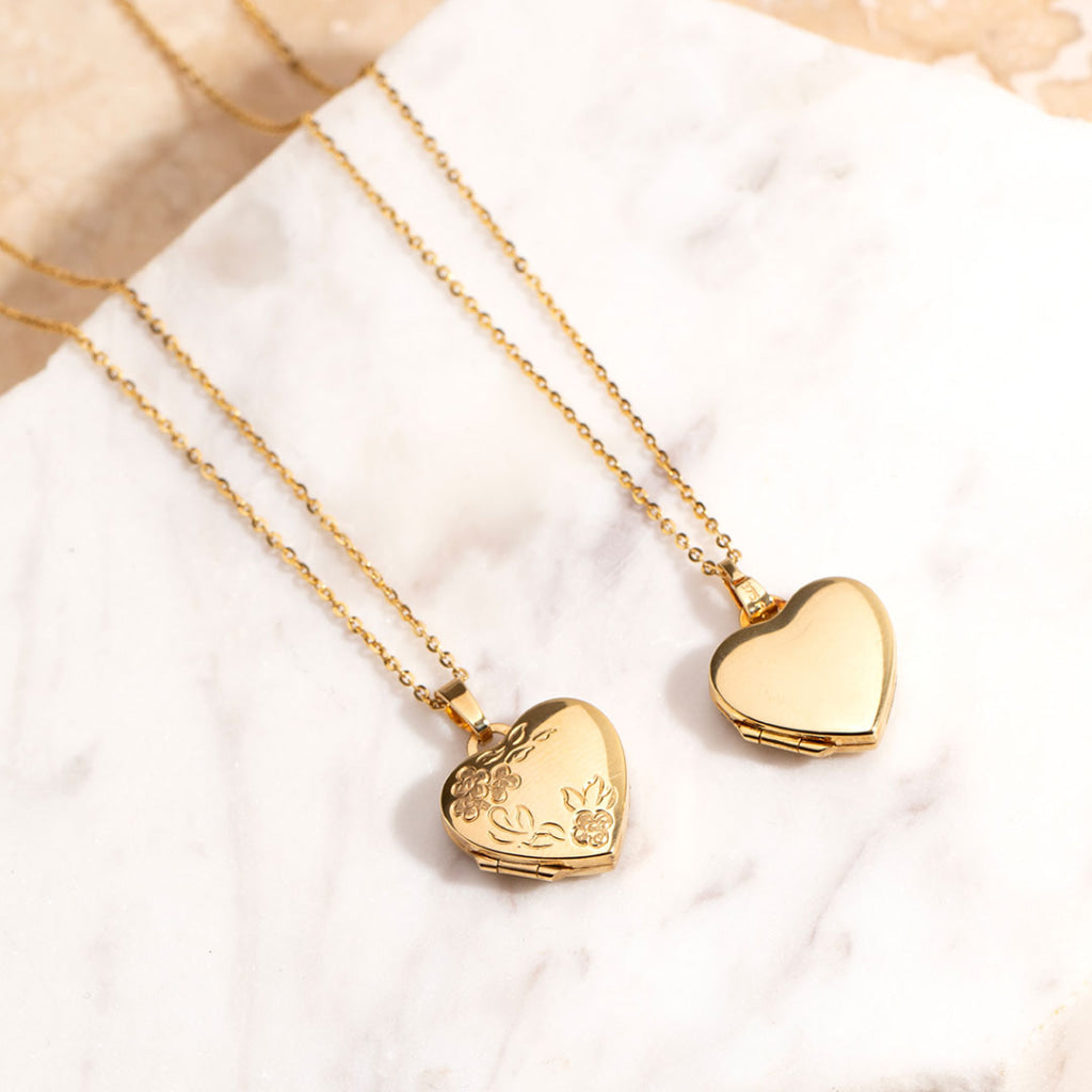 two heart lockets with chains