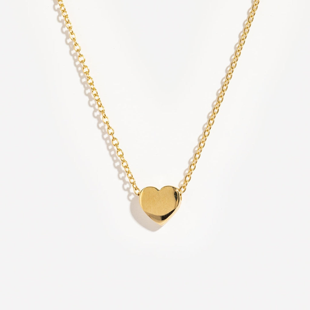 A delicate necklace with a sliding heart.  Crafted in superb quality 9ct gold 