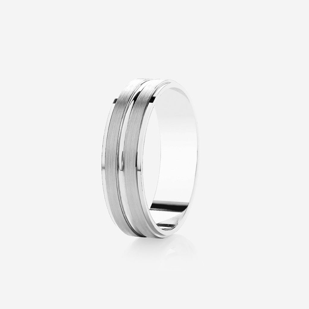 Mens wedding ring on a grey background