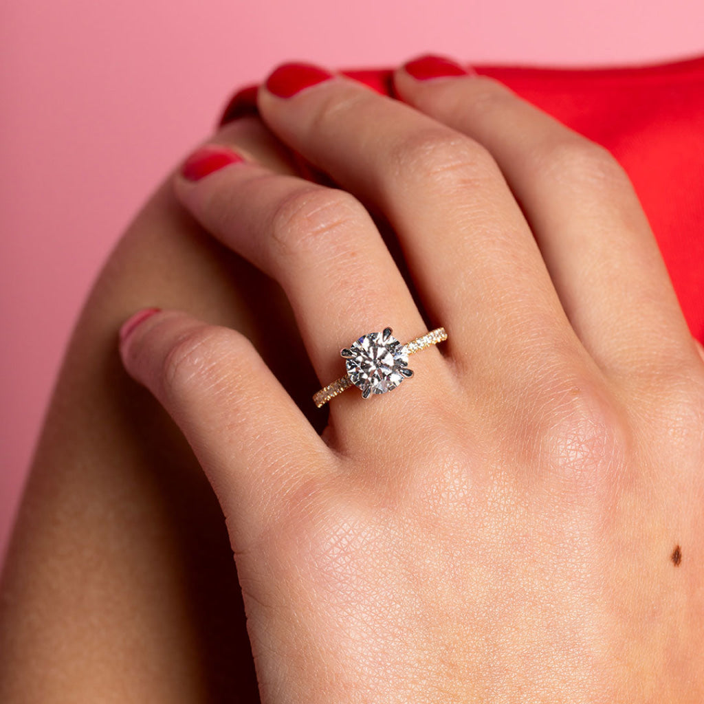 round diamond engagement ring on model