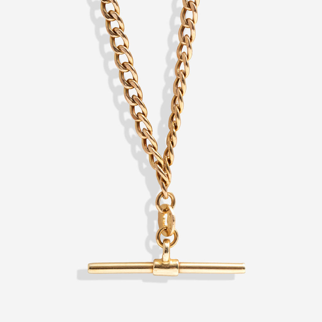 gold straight t bar on white background