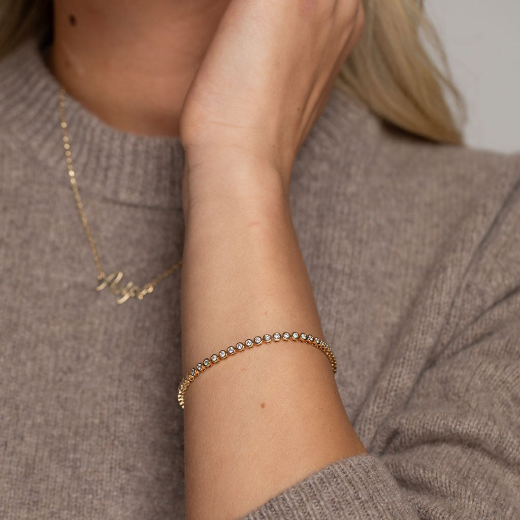 diamond tennis bracelet paired with name chain