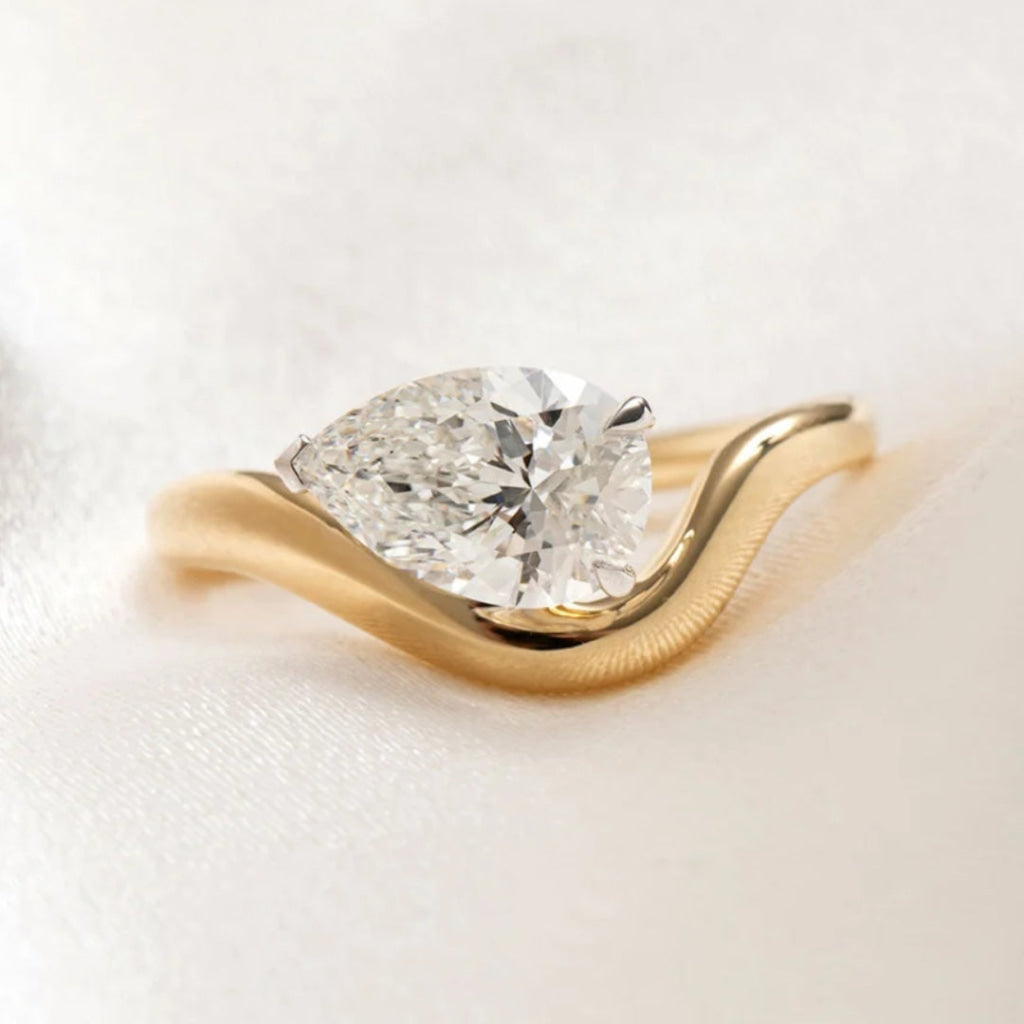 sideways pear cut engagement ring 