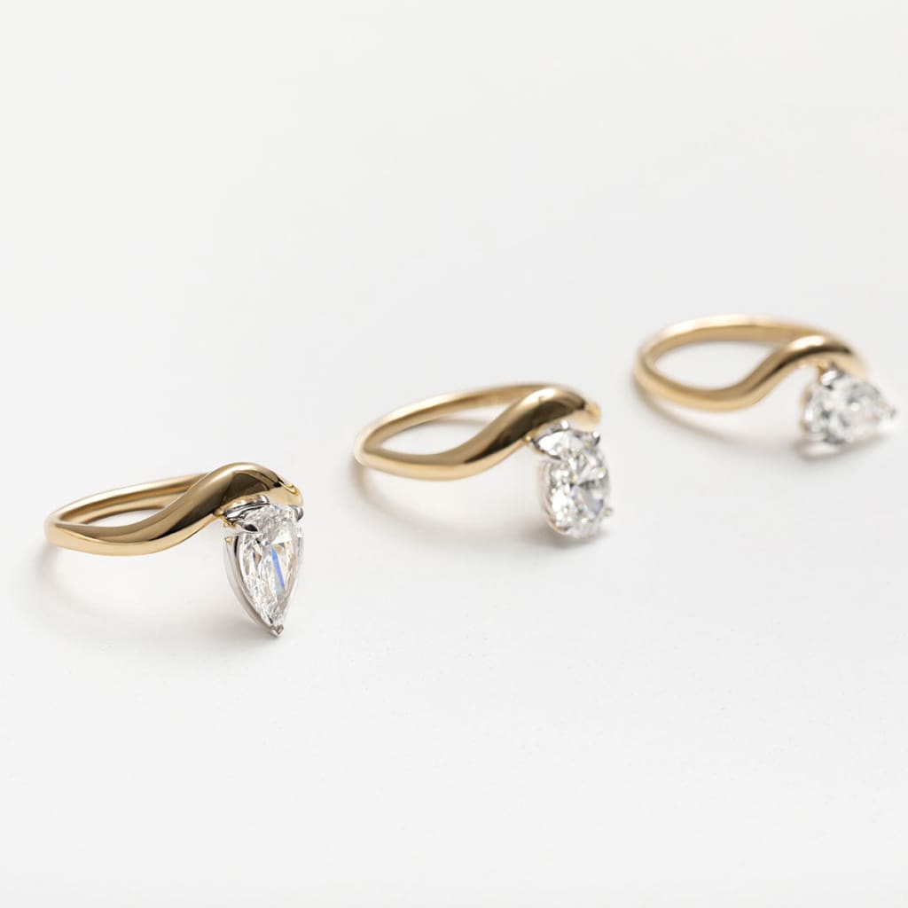 three curved band engagement rings