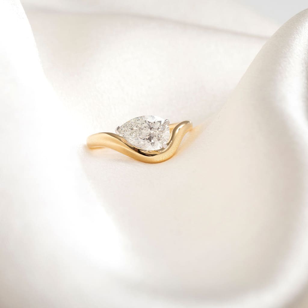 yellow gold sideways pear cut engagement ring