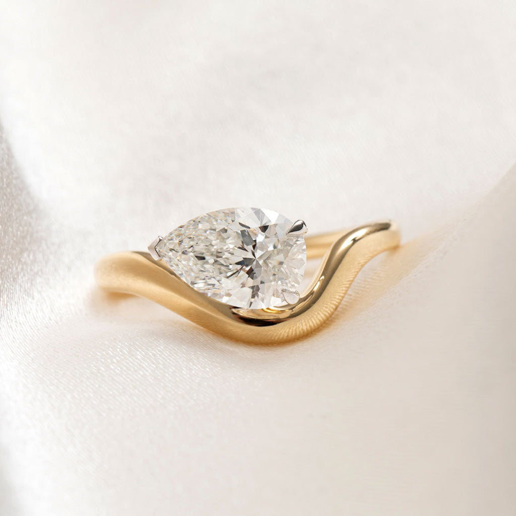 sideways pear cut engagement ring 