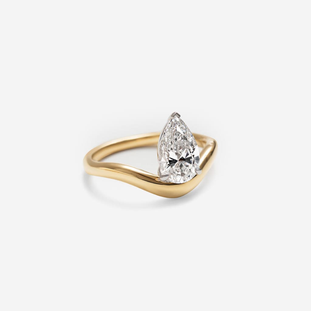 side view of yellow gold pear cut ring