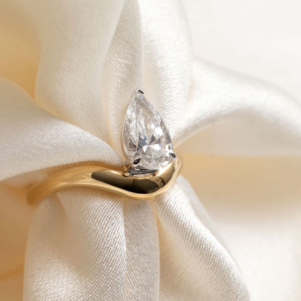 close up of pear cut engagement ring