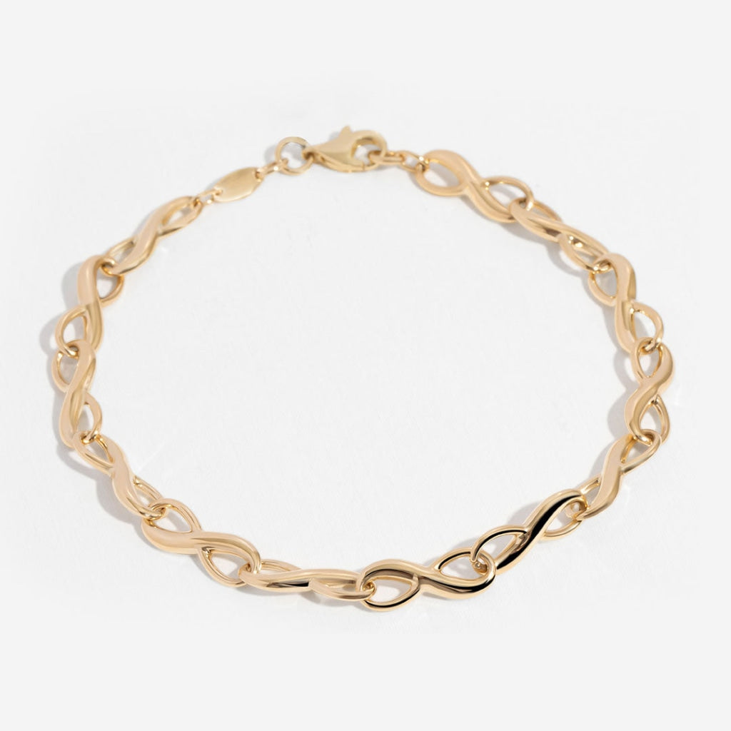 Ladies Gold Infinity Bracelet on white