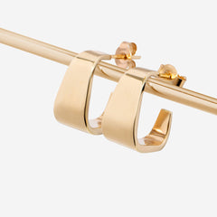 gold square half hoops on white background