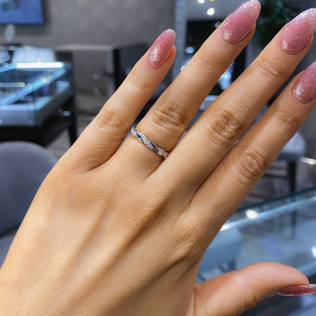 Diamond Wedding Ring on a woman's hand.