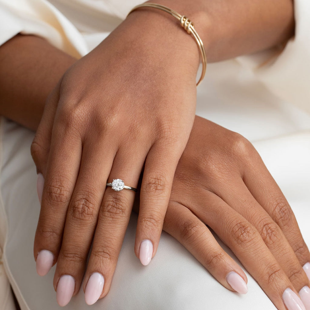 Models hands wearing Jupiter platinum diamond engagement ring