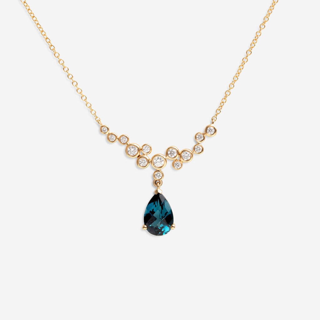 london blue topaz and diamond necklace on white background