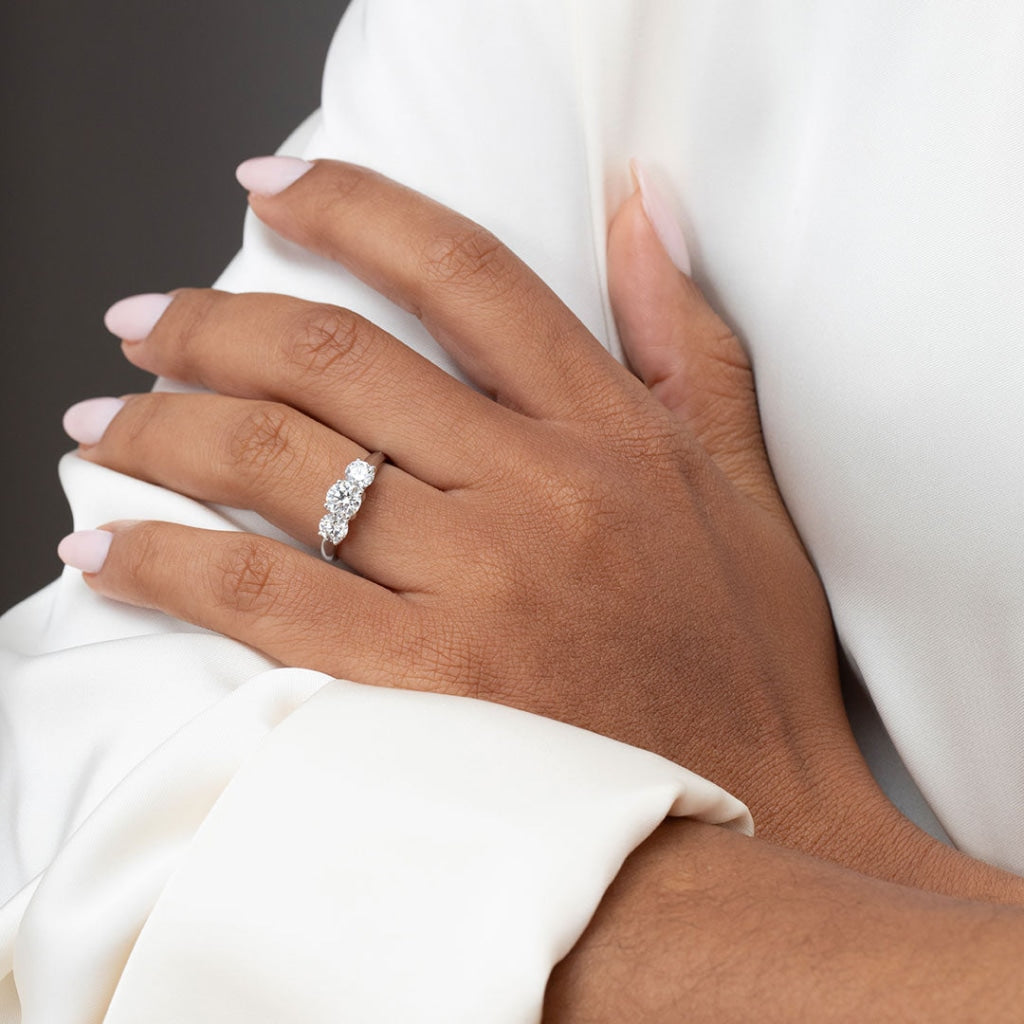 Three stone engagement ring on ladies hand