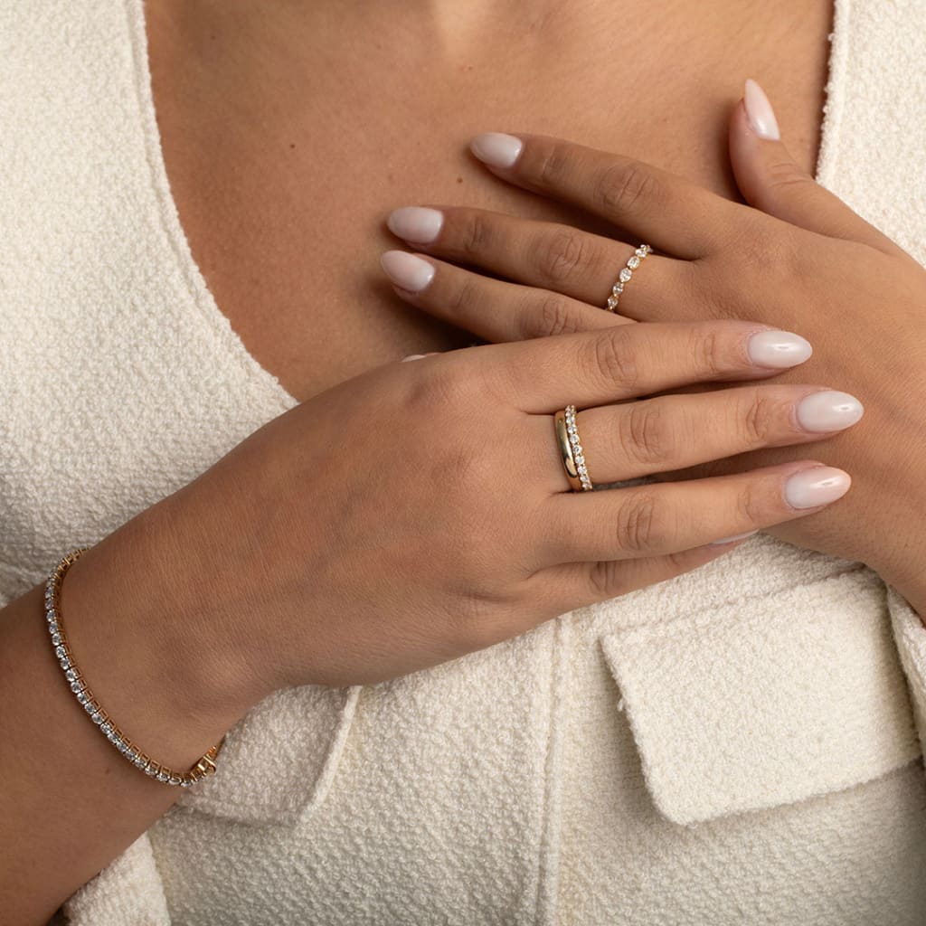 ladies diamond wedding ring on models hand stacked