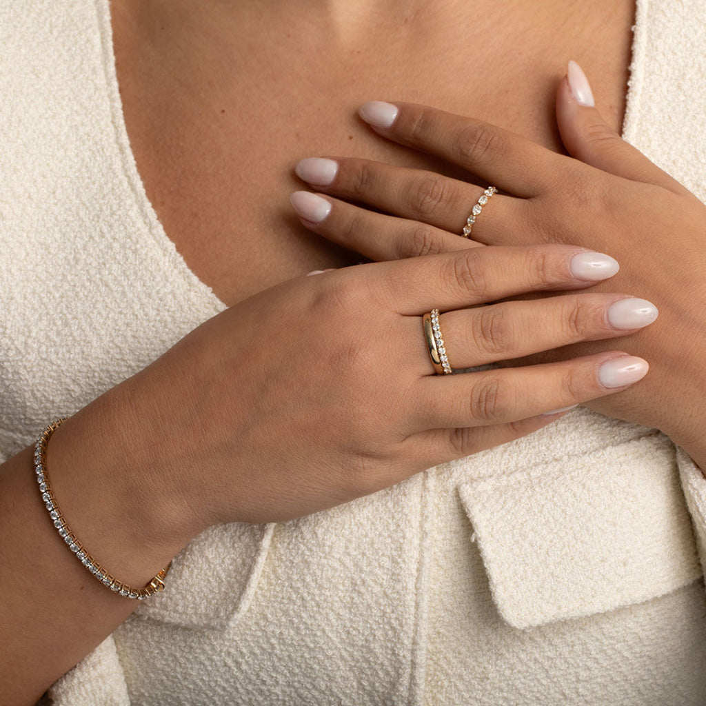 ladies diamond wedding ring on models hand stacked