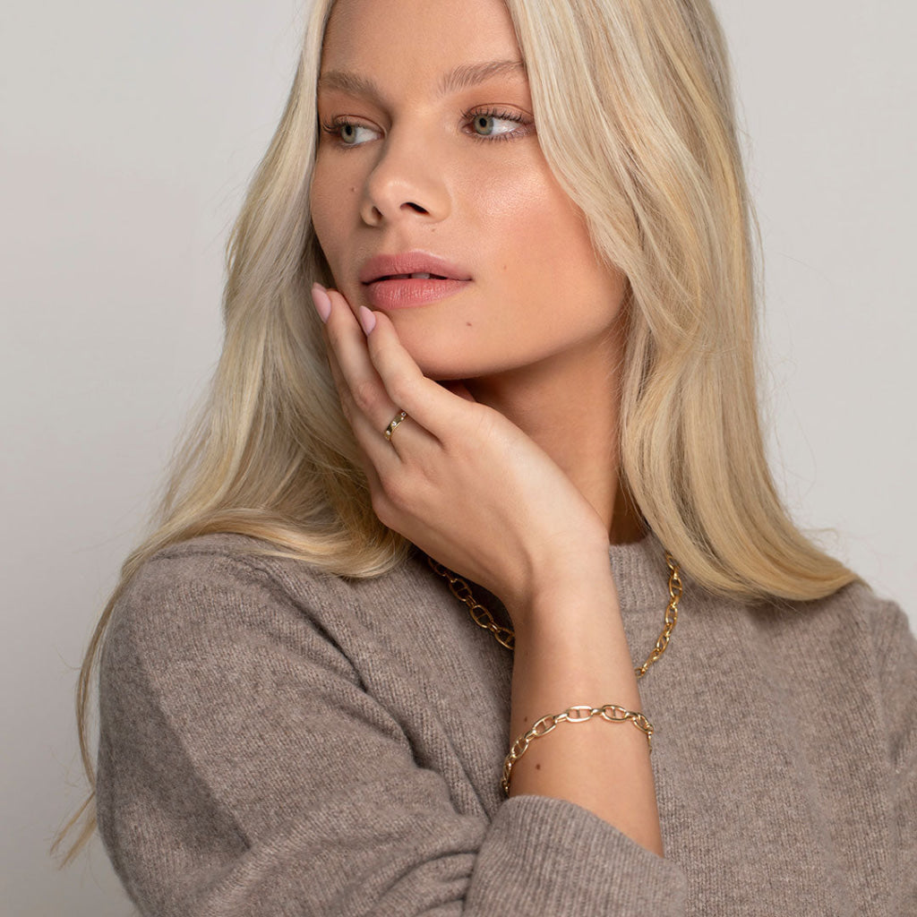 model wearing yellow gold jewellery selection