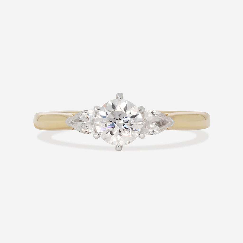 three stone diamond engagement ring on white background