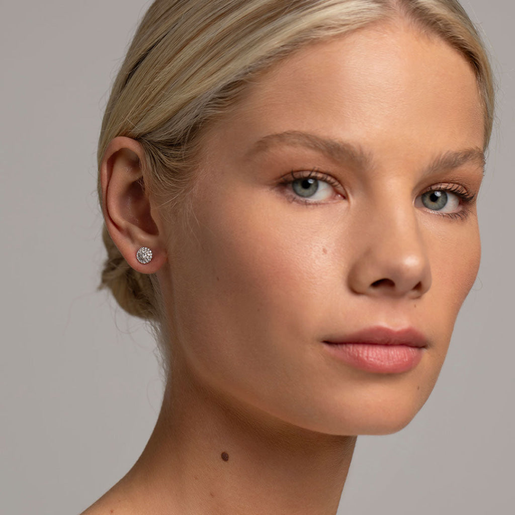 model wearing diamond earrings