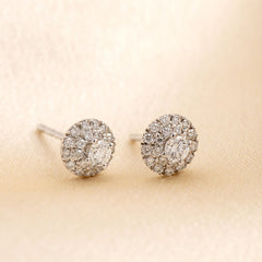 Photo of a pair of diamond halo earrings