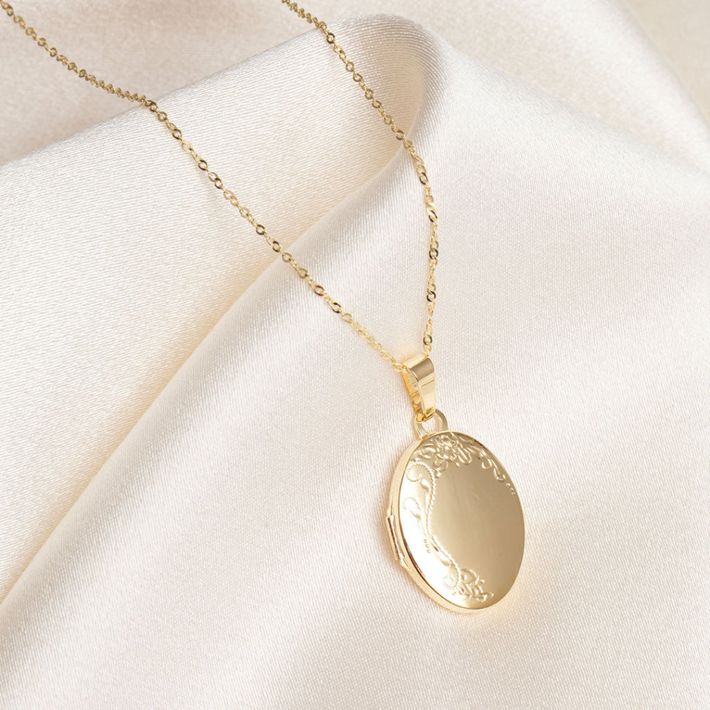 yellow gold engraved locket