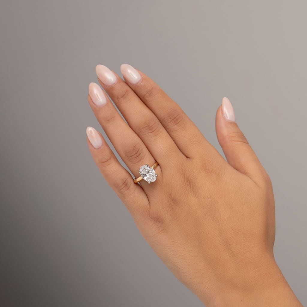 oval solitaire on hand