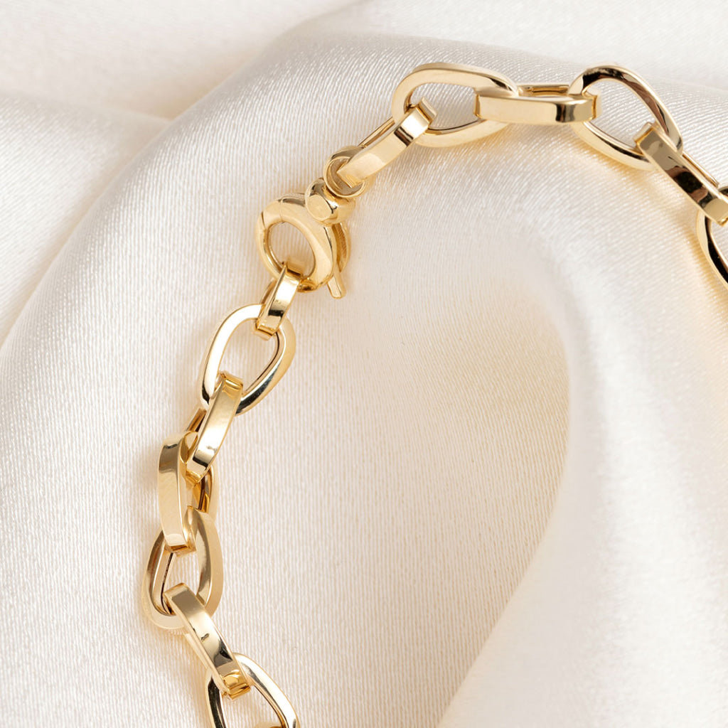 clasp close up on yellow gold bracelet