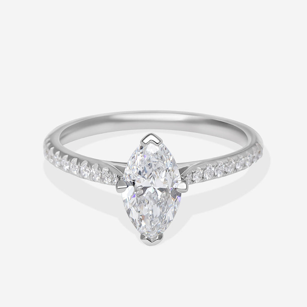 A platinum diamond ring featuring a marquise-cut center stone and pavé-set diamonds along the band.