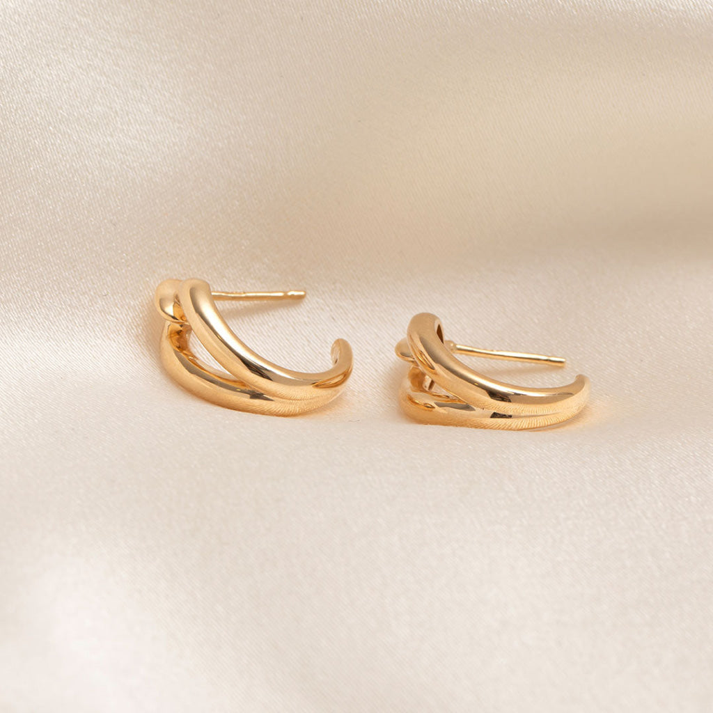 stem view of yellow gold looped earrings