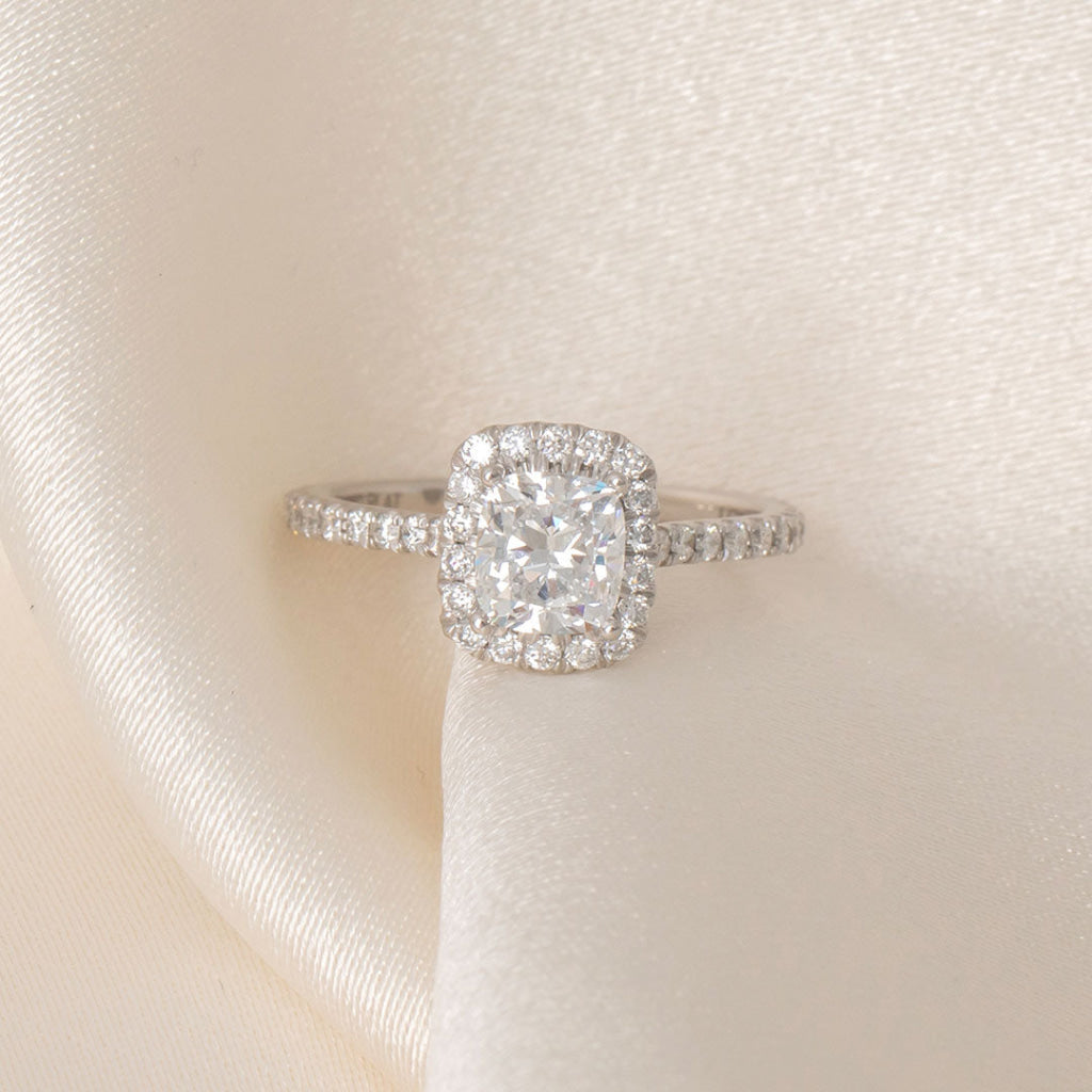Cushion halo lab grown diamond engagement ring.