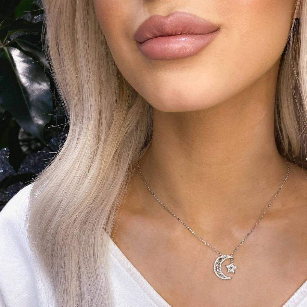 Woman wearing sterling silver Night Sky necklace.