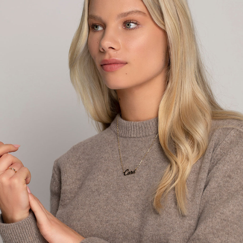 model wearing name chain in gold