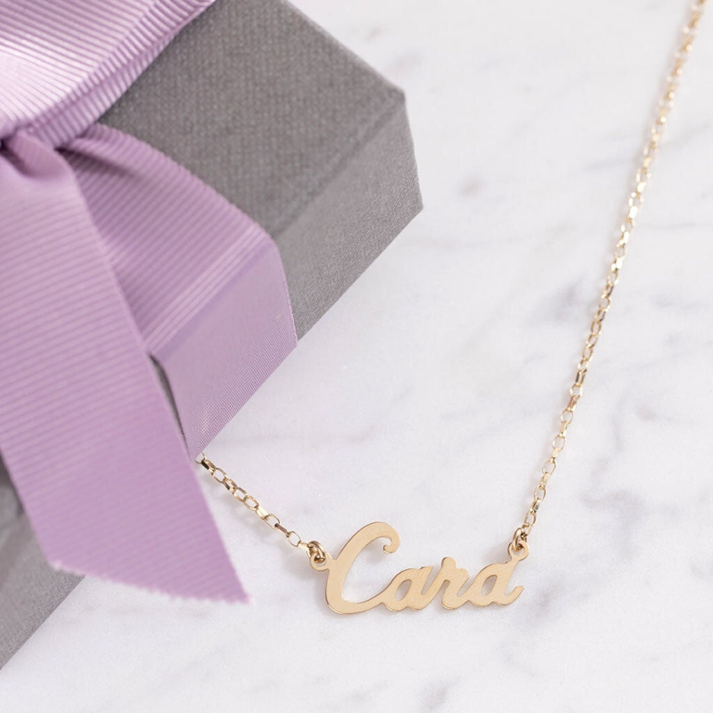 NAME NECKLACE | 9ct Gold - Necklace on marble background