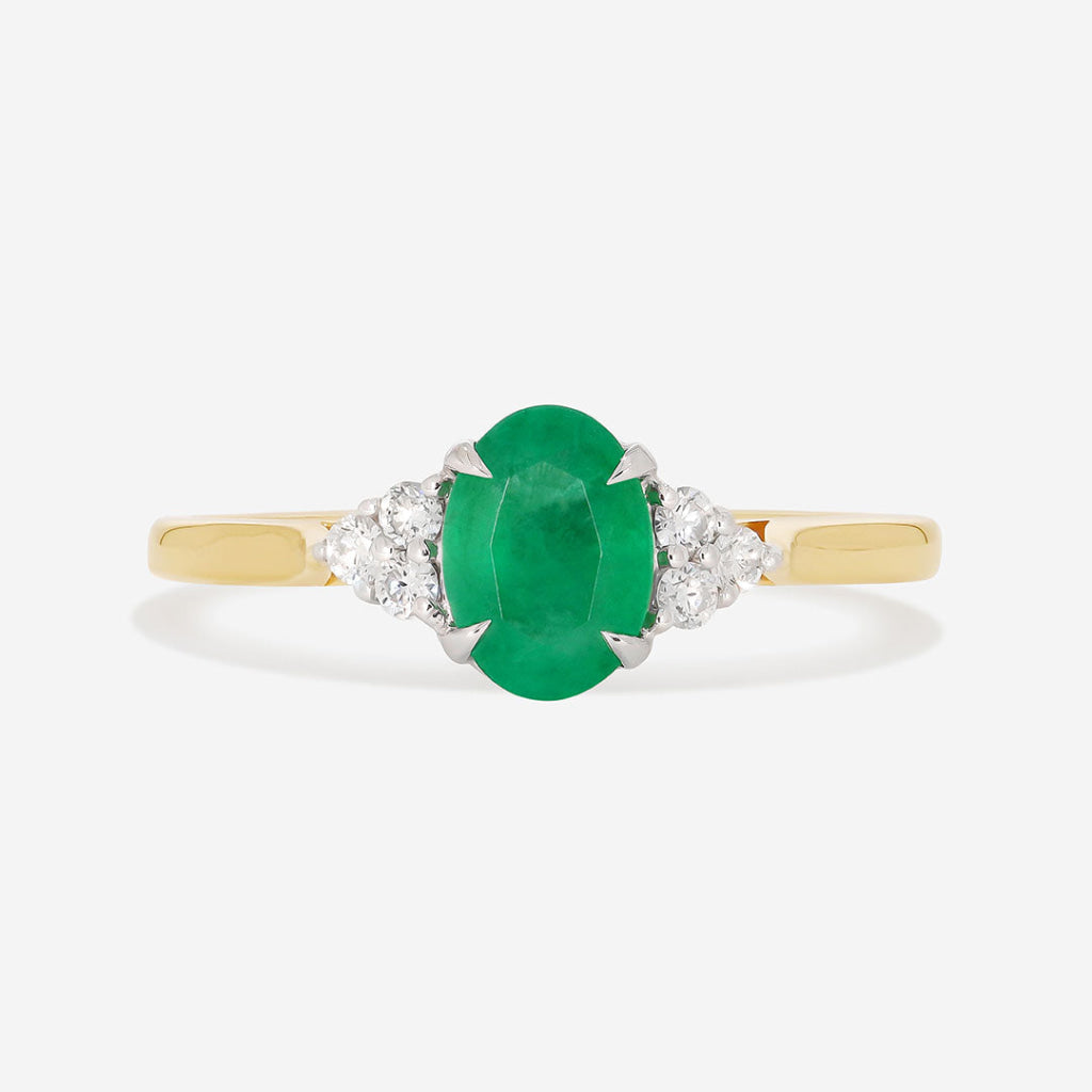 diamond emerald ring on white background
