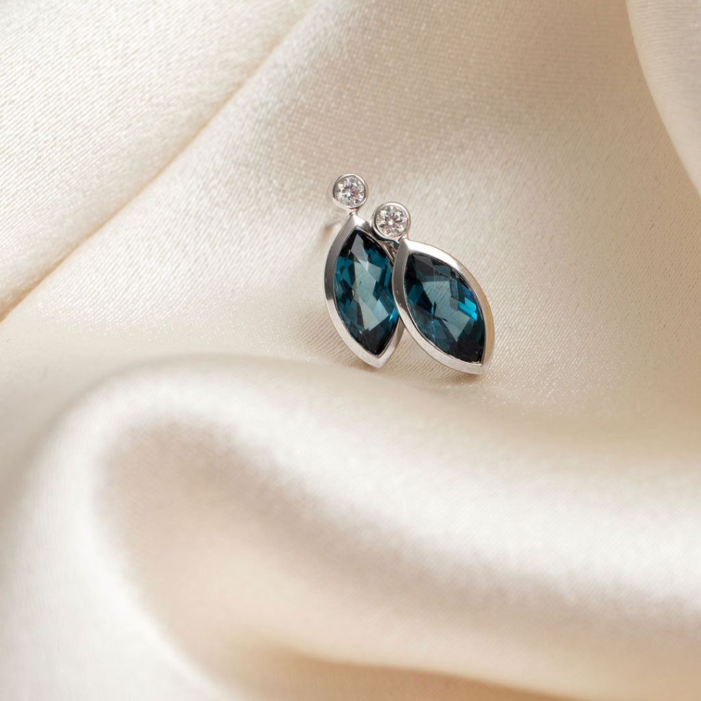 london blue topaz and diamond earrings set in white gold