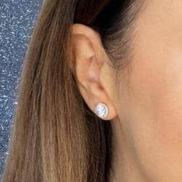 Woman wearing 9ct gold Halo Sparkle Earrings | Gear Jewellers Dublin