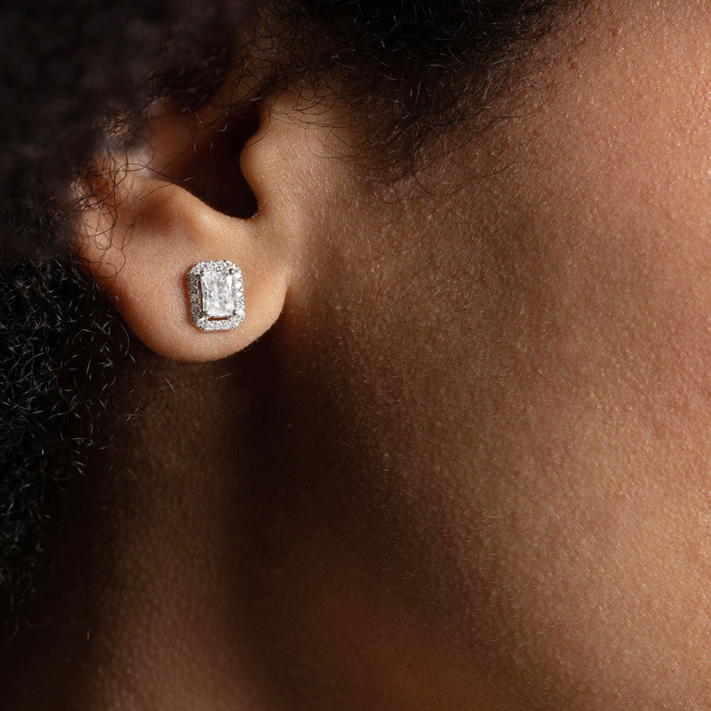Radiant cut lab grown diamond earrings worn in models ear