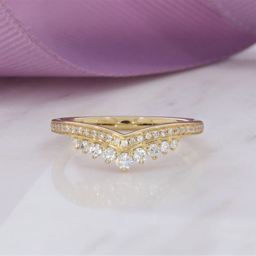 Shaped diamond set wedding ring made with 18ct gold