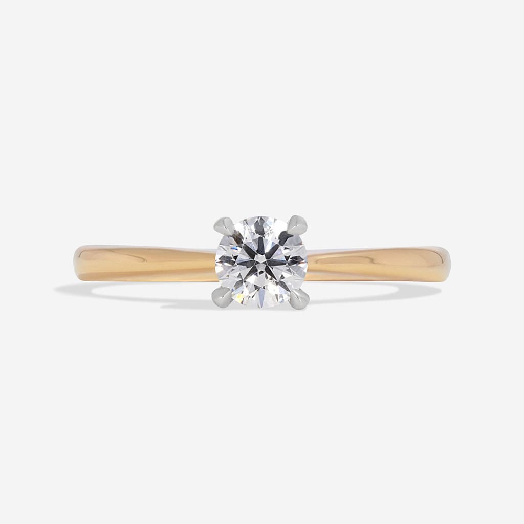 round diamond engagement ring with yellow gold band