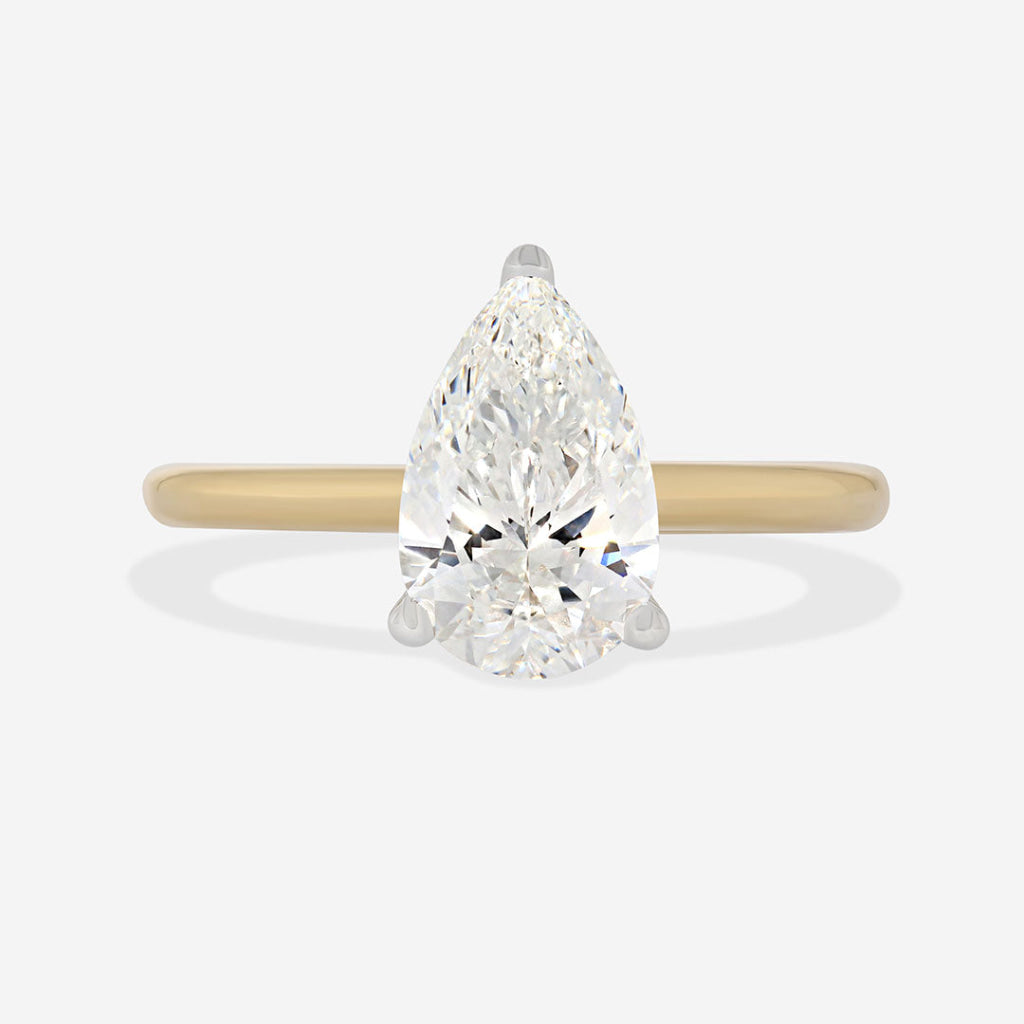 pear cut lab grown solitaire on a yellow gold band