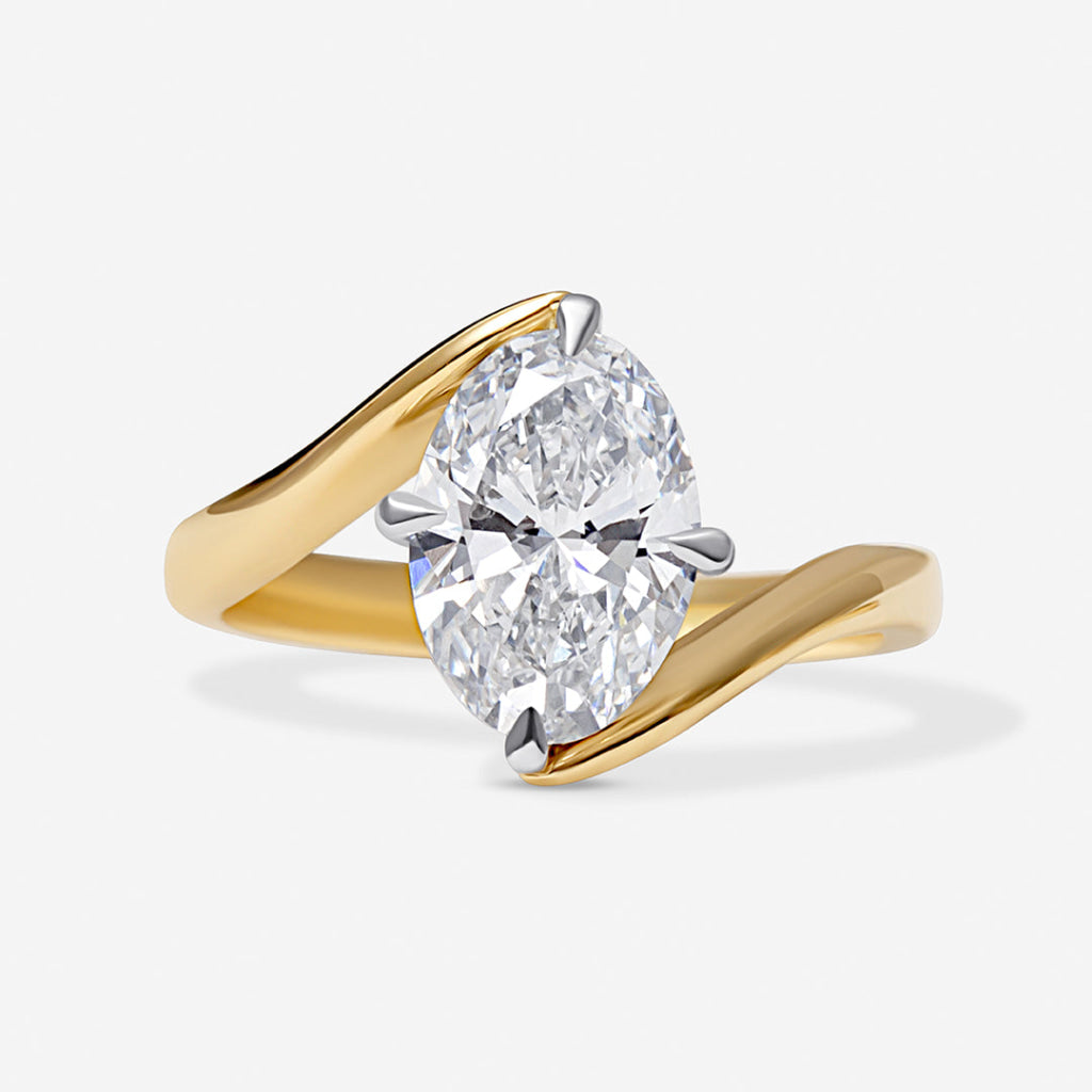 An oval cut lab grown diamond engagement ring.