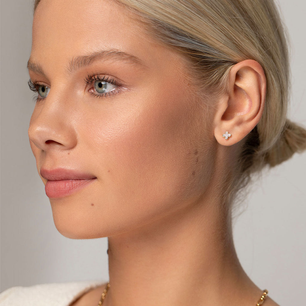 model wearing mother of pearl stud earrings